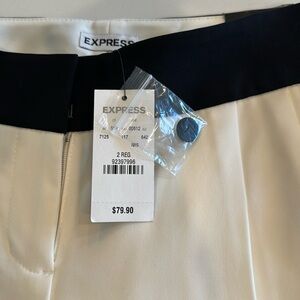 Brand new cream wide leg dress pants trimmed with a black waist. Super classy!